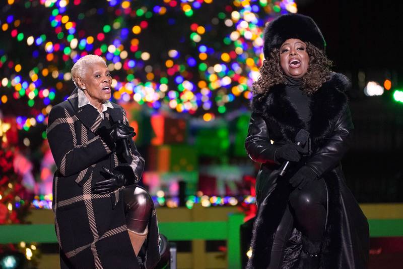 WASHINGTON, DC - NOVEMBER 30: Dionne Warwick and Ledisi perform "Have Yourself a Merry Little Christmas" during the Lighting Ceremony of the National Christmas Tree in President's Park in the Ellipse of the White House on November 30, 2023 in Washington, DC. High winds toppled the tree on Tuesday but workers were able to right the 40-foot Norway spruce, which was planted just two weeks ago to replace another tree, planted in 2021, that had developed a fungal disease. (Photo by Nathan Howard/Getty Images)