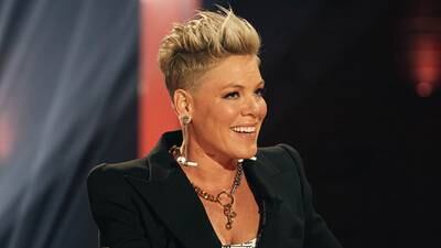 Pink says songs like "Who Knew" stop her from "numbing" her emotions